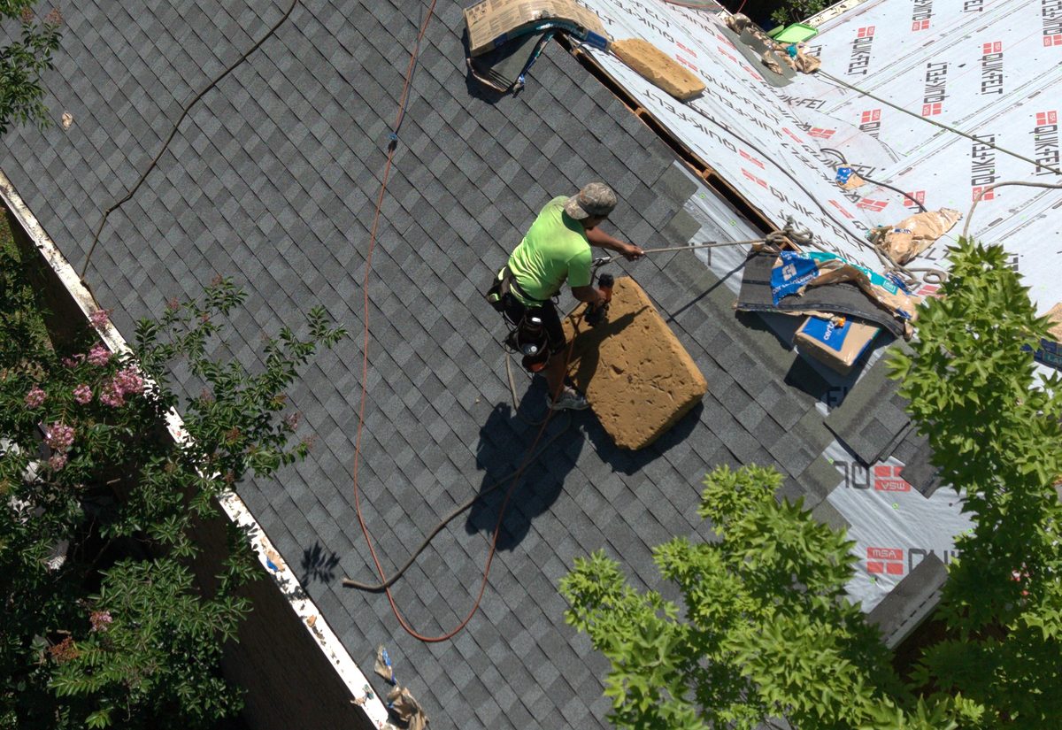 Brogdon Roofing crew member installing shingles in Oak Ridge TN